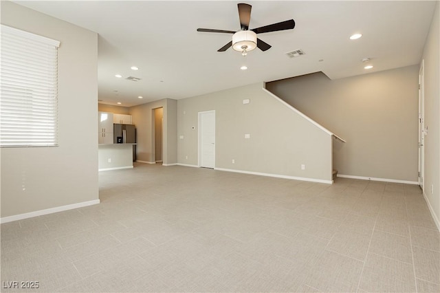 unfurnished living room featuring ceiling fan