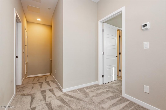 hall with carpet, baseboards, and recessed lighting