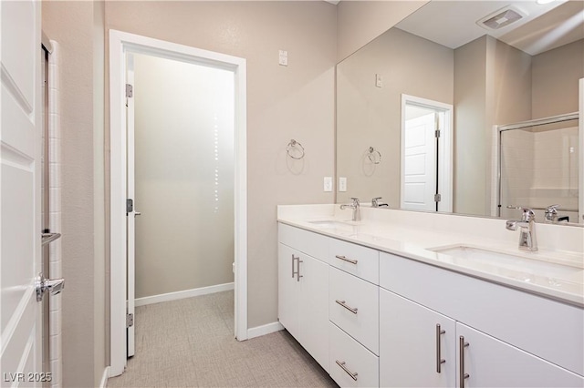 full bathroom with visible vents, a sink, baseboards, and double vanity