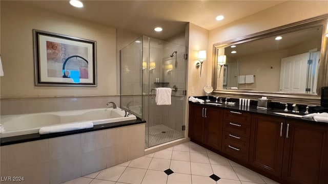 bathroom with tile patterned floors, plus walk in shower, and vanity