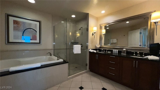 bathroom with tile patterned floors, vanity, and independent shower and bath