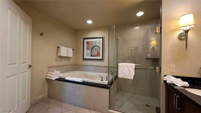 bathroom with tile patterned floors, separate shower and tub, and vanity