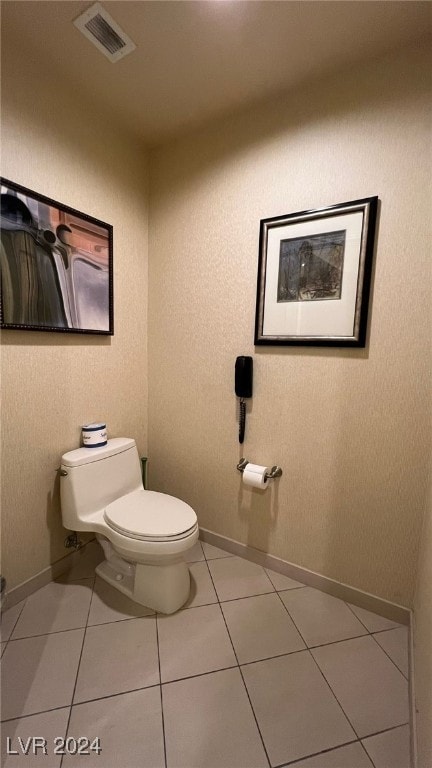 bathroom featuring toilet and tile patterned floors