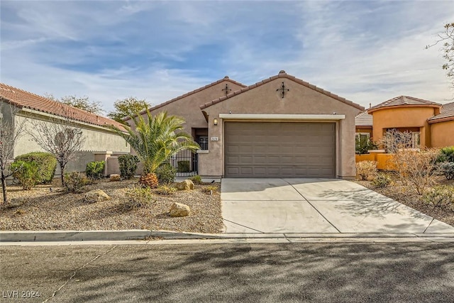 mediterranean / spanish house featuring a garage