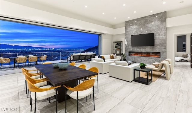 living room featuring a fireplace and a mountain view