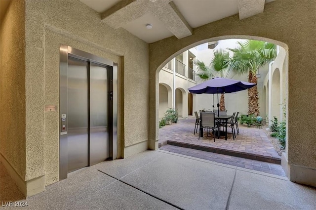 view of patio featuring elevator