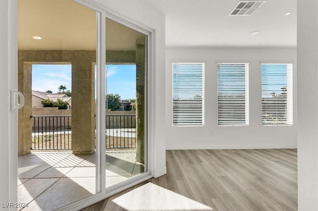 doorway to outside featuring light hardwood / wood-style flooring