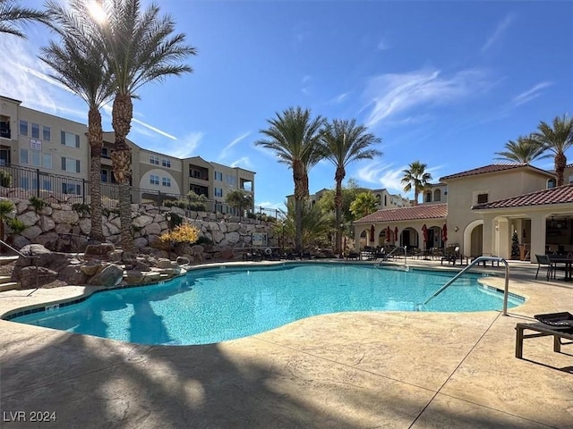 view of swimming pool featuring a patio