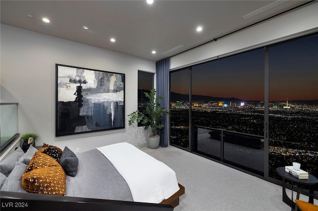 bedroom featuring a fireplace and carpet