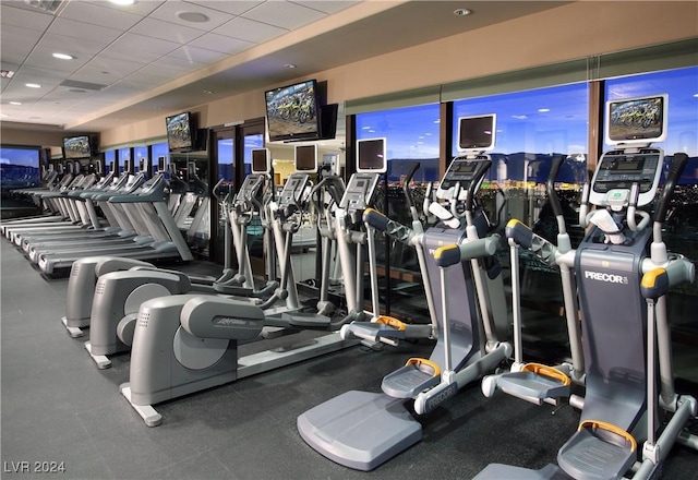 gym with a paneled ceiling