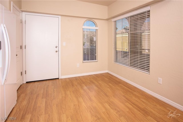 empty room with light wood-type flooring