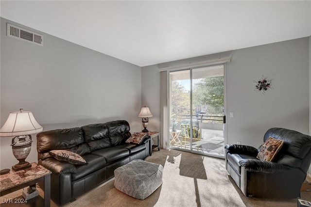 living room with visible vents and carpet flooring