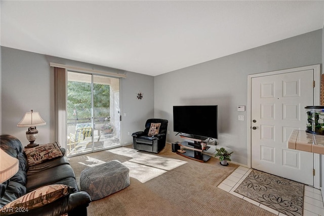 living room with tile patterned flooring and carpet