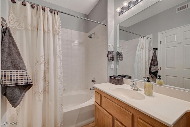 full bathroom featuring visible vents, shower / tub combo with curtain, and vanity