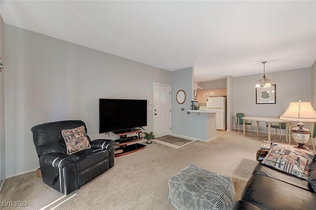 living room with a chandelier, baseboards, and light colored carpet