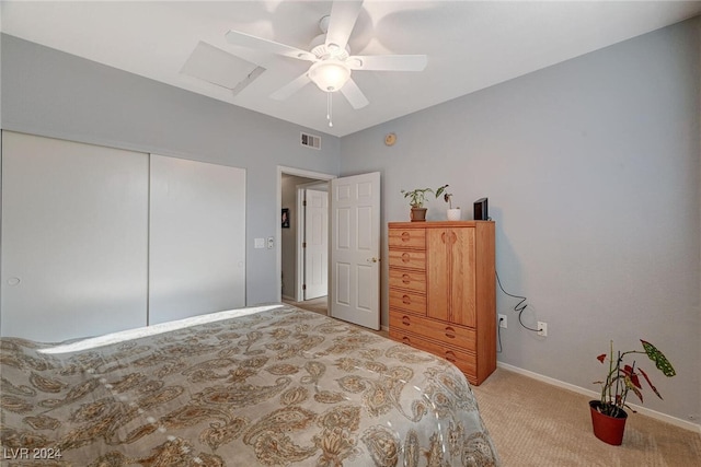 bedroom featuring carpet floors, a closet, visible vents, attic access, and baseboards