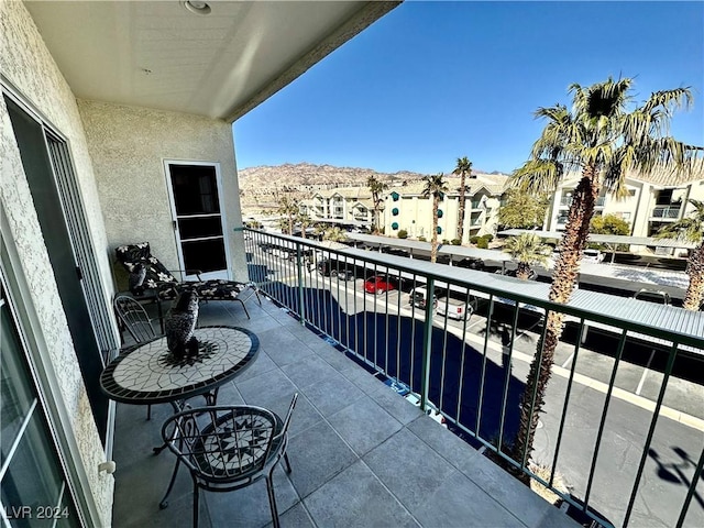 balcony featuring a mountain view