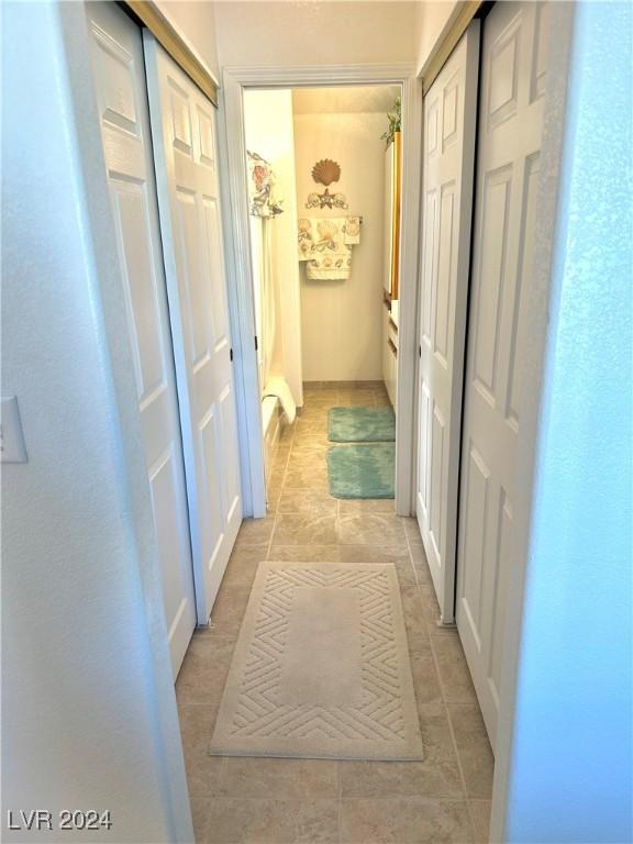 hallway with light tile patterned flooring