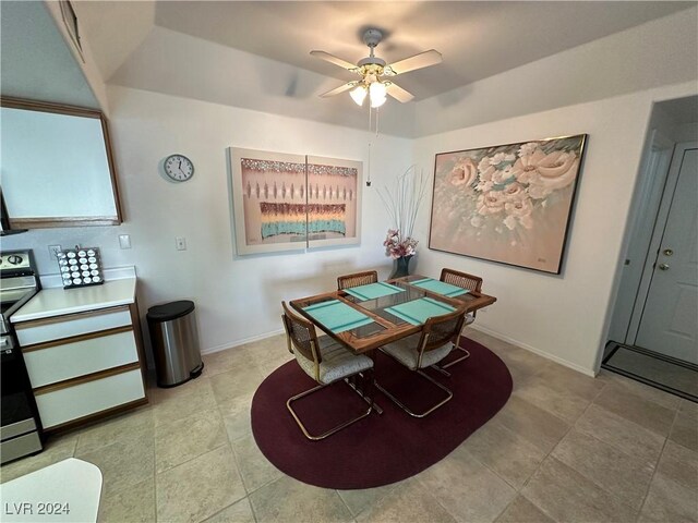 dining area featuring baseboards and a ceiling fan