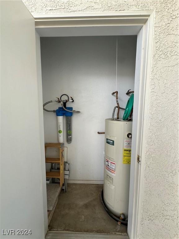 utility room with water heater