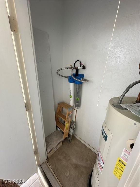 utility room featuring electric water heater