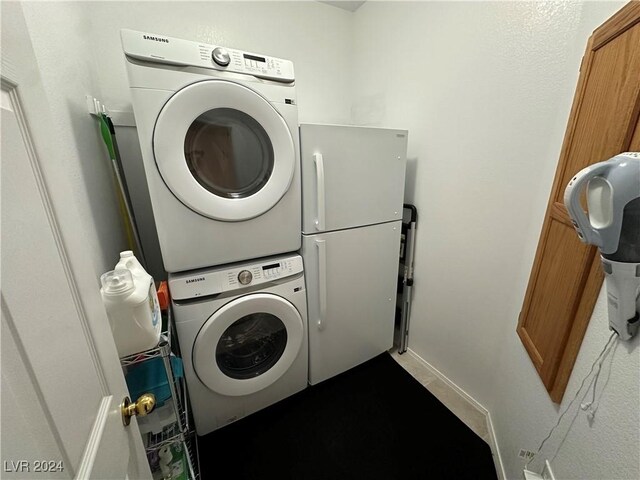 laundry room featuring stacked washer / dryer