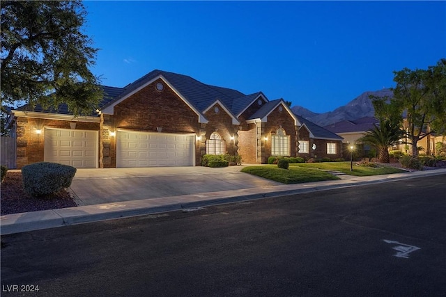 ranch-style house featuring a mountain view and a garage