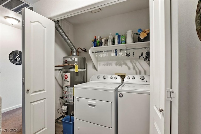 clothes washing area featuring dark colored carpet, separate washer and dryer, and water heater