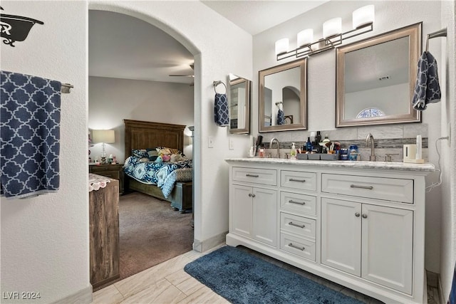 bathroom with vanity and ceiling fan