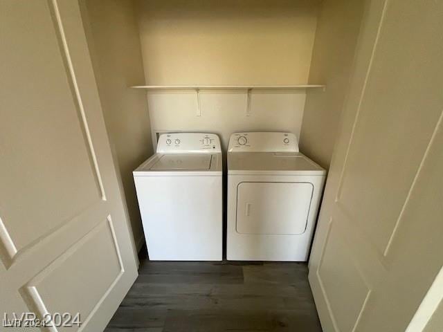 laundry area featuring independent washer and dryer and dark wood-type flooring