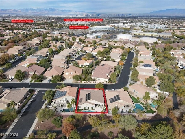 birds eye view of property with a mountain view