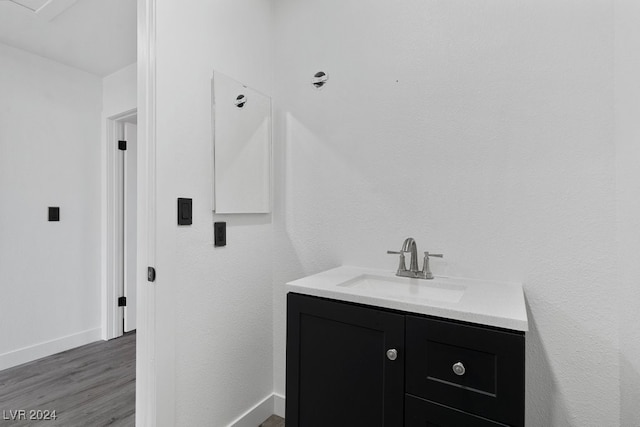 bathroom with hardwood / wood-style flooring and vanity