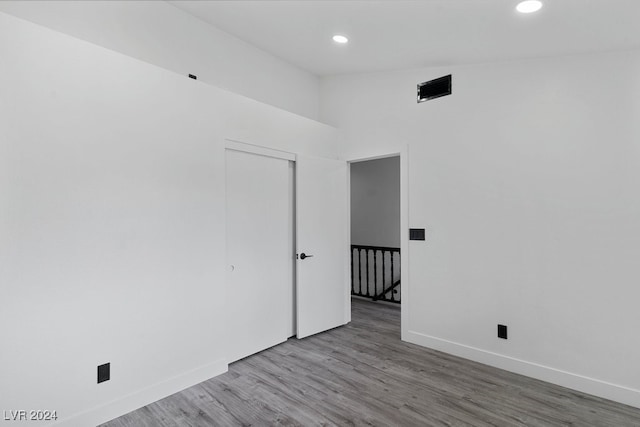 unfurnished room with hardwood / wood-style floors