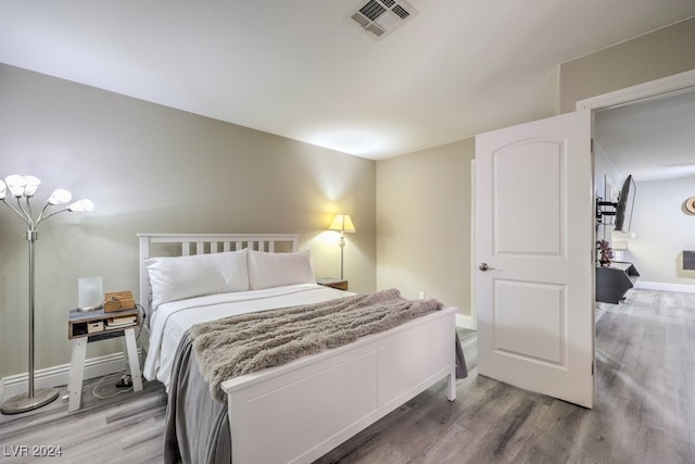 bedroom featuring hardwood / wood-style flooring