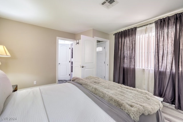 bedroom with light wood-type flooring