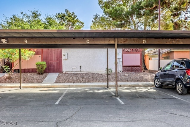 view of parking with a carport