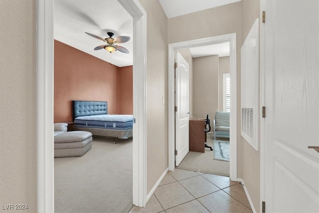 hallway with light colored carpet