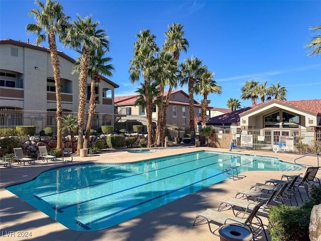 view of swimming pool with a patio area