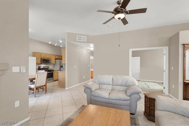 tiled living room featuring ceiling fan