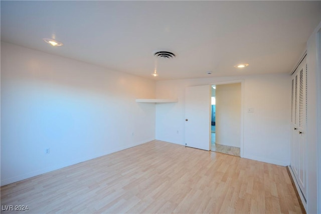 unfurnished room with light hardwood / wood-style floors