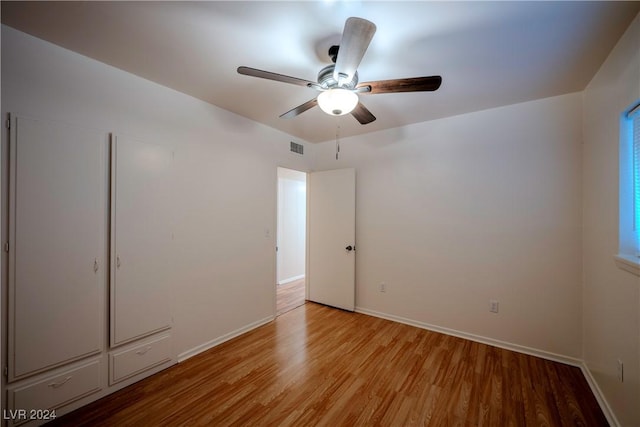 unfurnished bedroom with light hardwood / wood-style flooring and ceiling fan