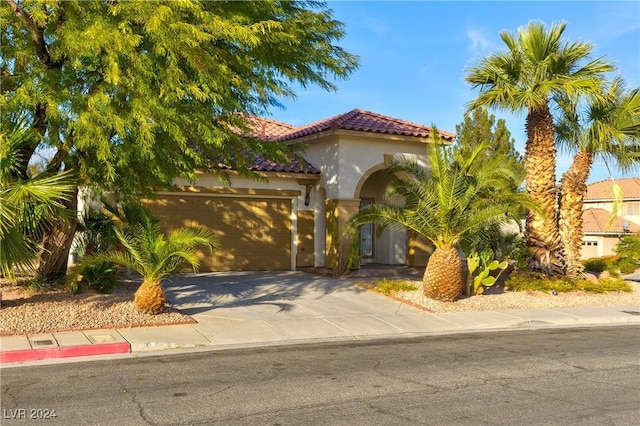 mediterranean / spanish-style house featuring a garage