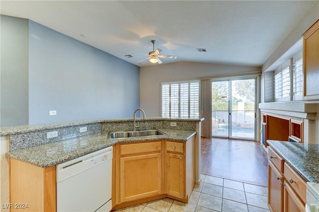 kitchen with dishwasher, lofted ceiling, sink, light hardwood / wood-style floors, and light stone counters