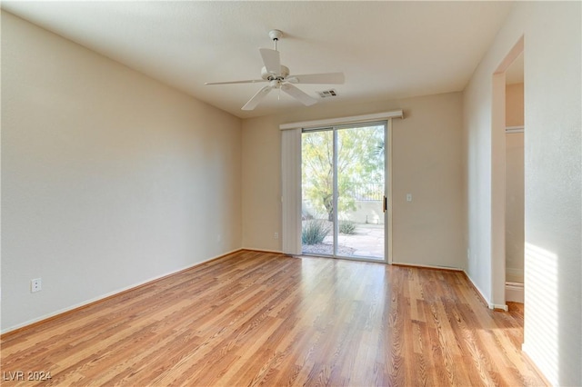 empty room featuring light wood-type flooring and ceiling fan