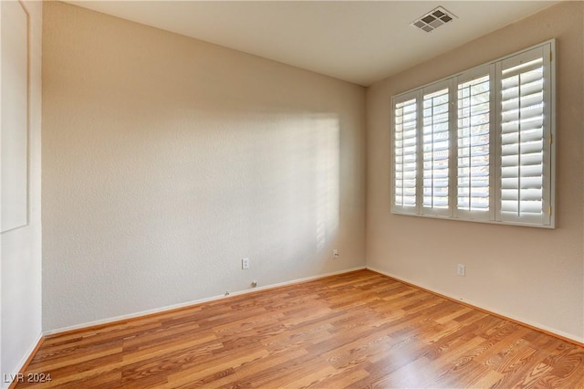 spare room featuring light wood-type flooring