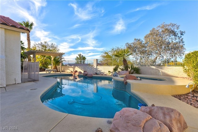 view of pool with a pergola and an in ground hot tub