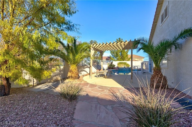 view of yard with a pergola and a patio area