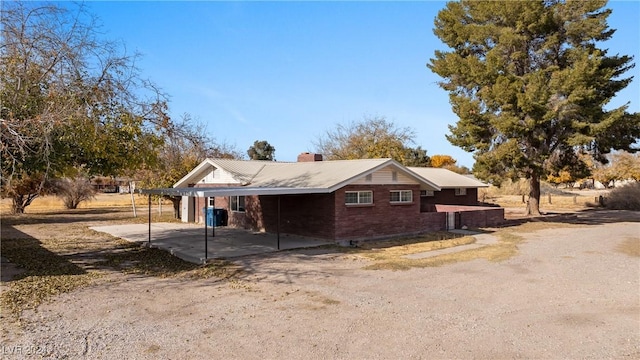 view of side of home featuring a patio