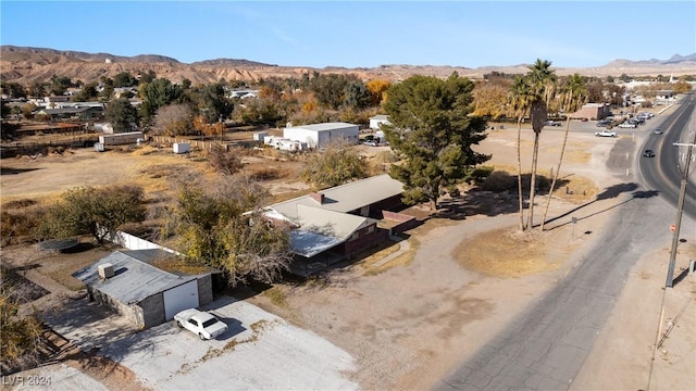 birds eye view of property featuring a mountain view