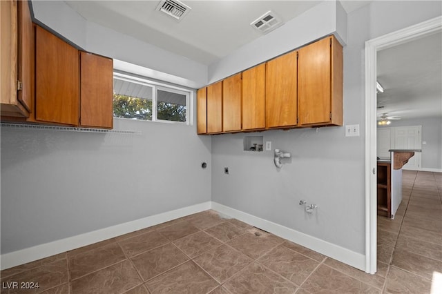 clothes washing area with cabinets, hookup for a washing machine, ceiling fan, electric dryer hookup, and hookup for a gas dryer